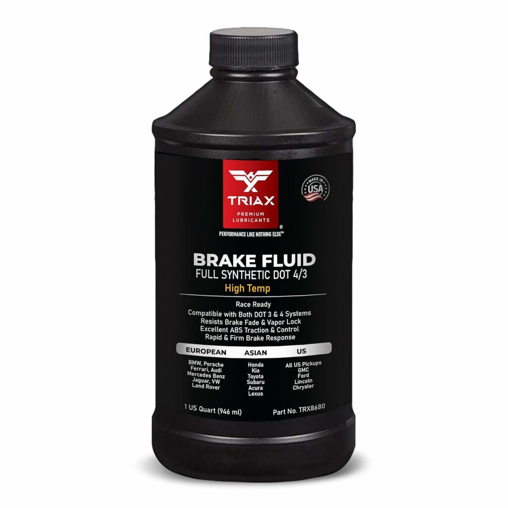 100k car maintenance. a black bottle with brake fluid written on it.