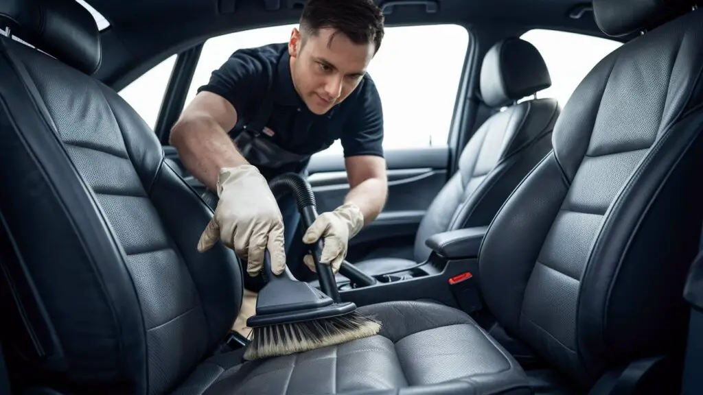 A man cleaning car seats