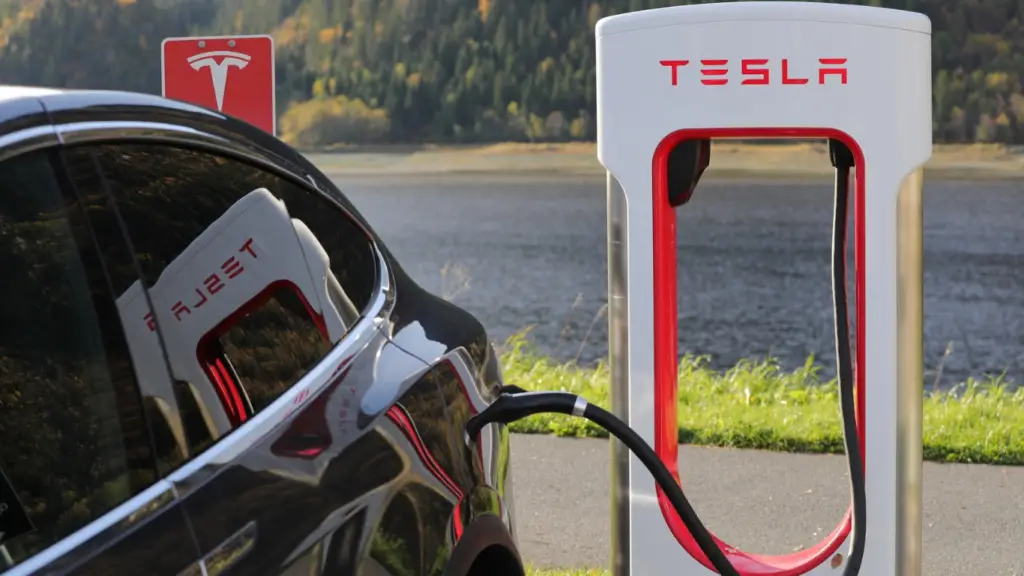 a tesla car at gas station