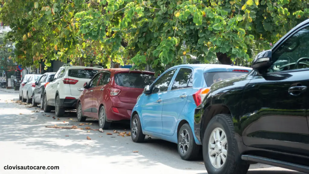 an image of cars parked in a straight line How to parallel park