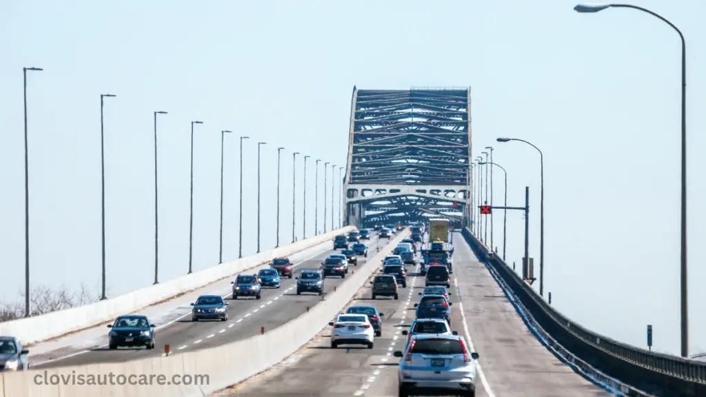 a bridge with plenty of cars moving with streetlights. Do You Need an Appointment for a Car Inspection in NJ?
